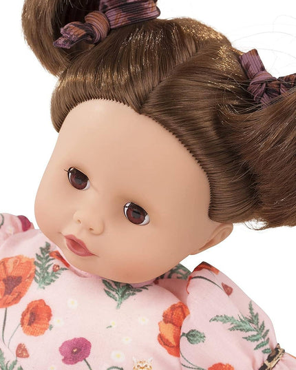 Gotz Catness Muffin Doll with floral dress and hair tied in buns on a white background