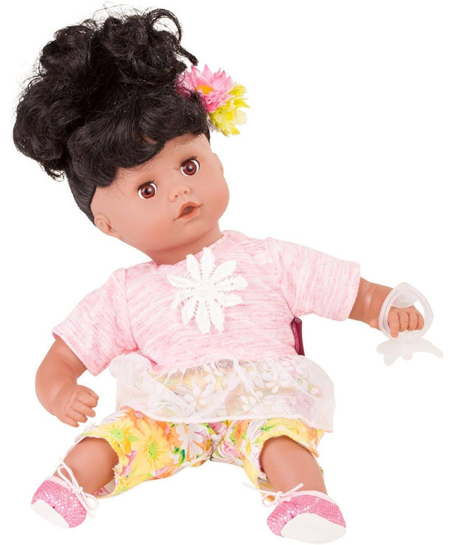 Doll with black hair, pink outfit, and colorful flowers on a white background