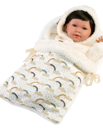 Baby doll wrapped in a white hooded blanket with rainbow pattern on a white background