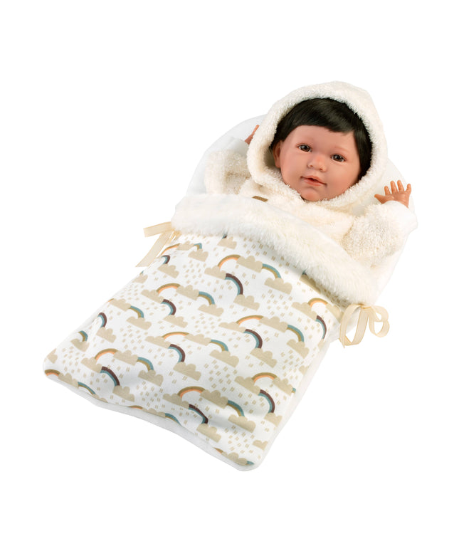 Baby doll wrapped in a white hooded blanket with rainbow pattern on a white background