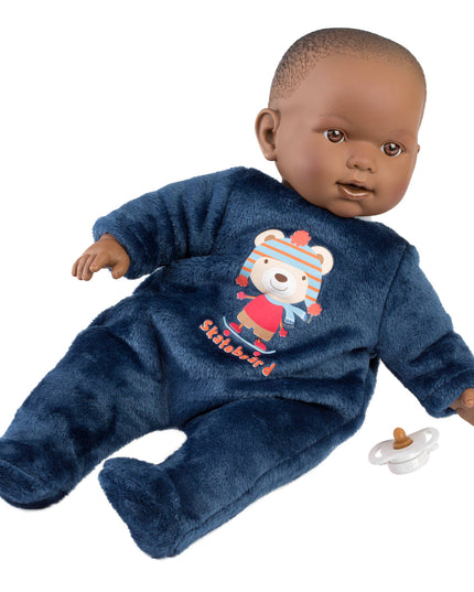 Baby doll wearing a blue onesie with a teddy bear design, holding a pacifier on a white background.