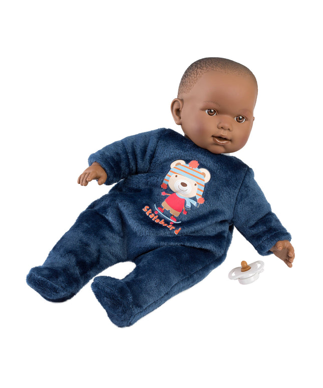 Baby doll wearing a blue onesie with a teddy bear design, holding a pacifier on a white background.