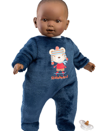 Baby doll wearing a blue onesie with a bear design on a white background