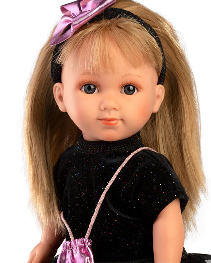 Doll with blonde hair, black dress, and pink accessories on a white background