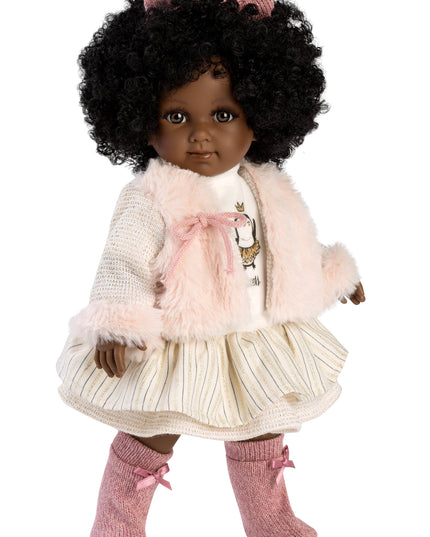 Doll with curly hair wearing a pink outfit on a white background