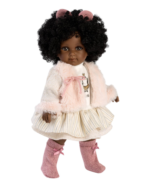 Doll with curly hair wearing a pink outfit on a white background