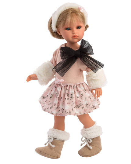Doll wearing a pink dress with a floral skirt, white fur trim, and brown boots on a white background