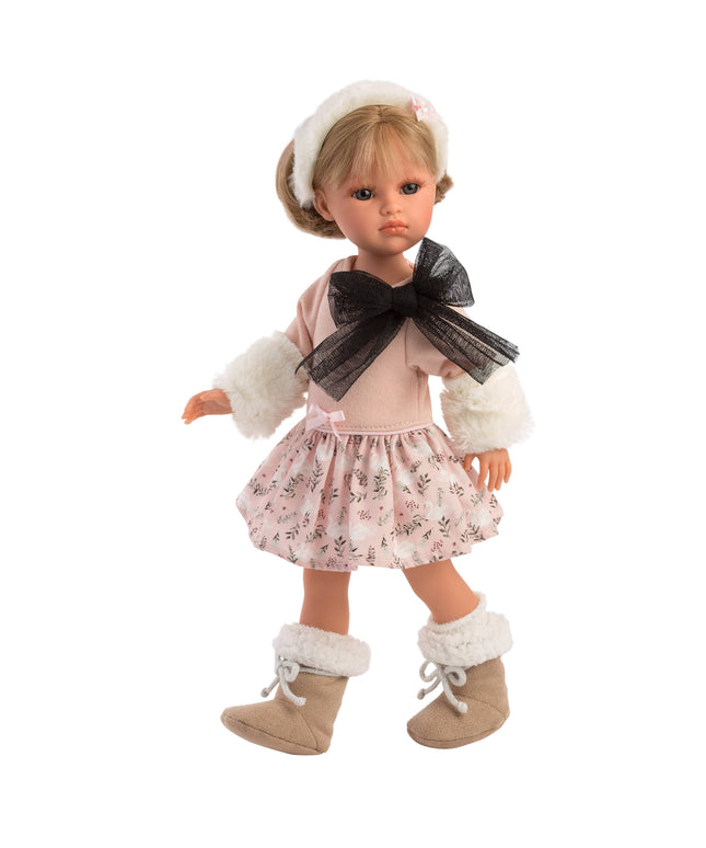 Doll wearing a pink dress with a floral skirt, white fur trim, and brown boots on a white background