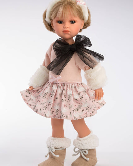 Doll wearing a floral dress with a black bow and white boots on a white background