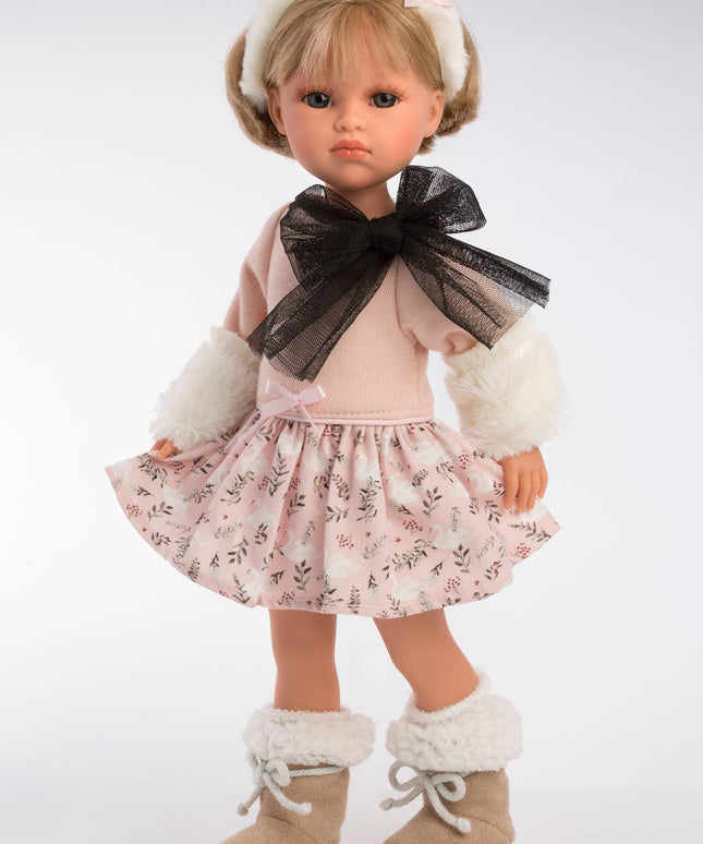 Doll wearing a floral dress with a black bow and white boots on a white background