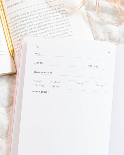 Open book with a blank page on a textured surface