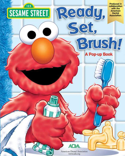 Sesame Street book cover with Elmo holding a toothbrush and toothpaste, featuring the American Dental Association logo.