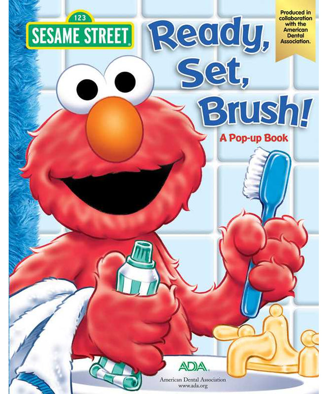 Sesame Street book cover with Elmo holding a toothbrush and toothpaste, featuring the American Dental Association logo.