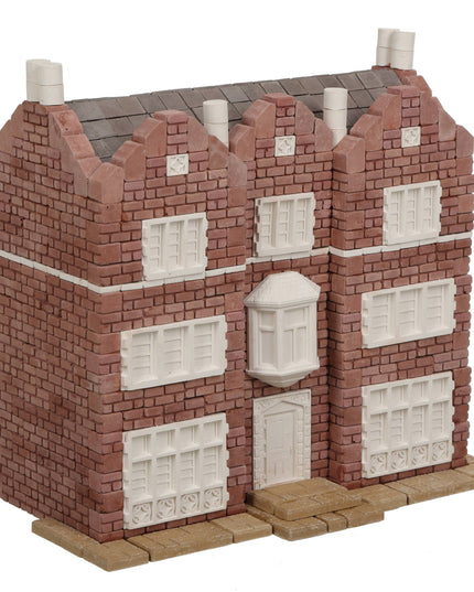 Model of a brick building with white windows on a white background