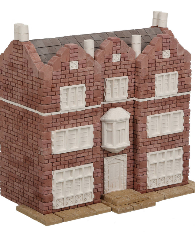Model of a brick building with white windows on a white background