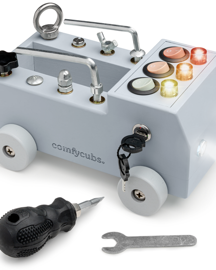 Children's toy truck with lights and tools on a white background