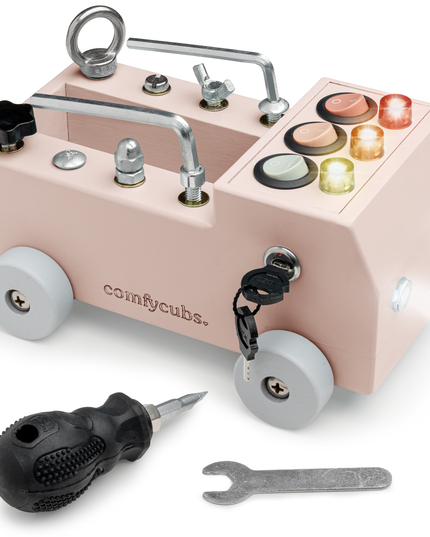 Toy mechanic set with pink toolbox and tools on a white background