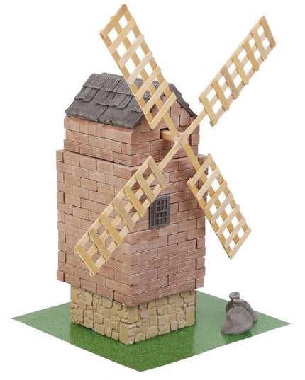 Model of a windmill made from interlocking bricks on a white background
