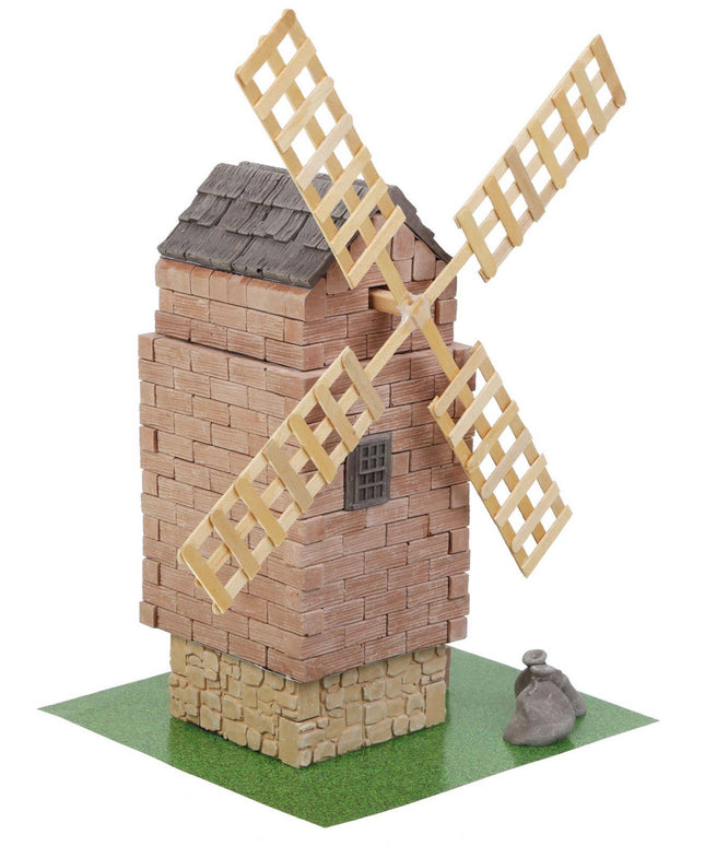 Model of a windmill made from interlocking bricks on a white background