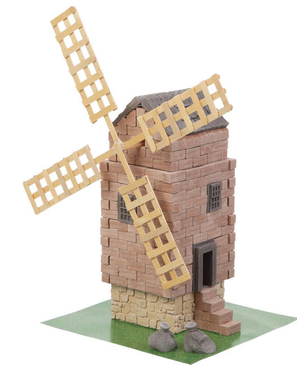 Model of a windmill made from interlocking bricks on a white background