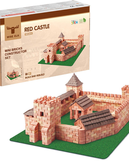 Red castle mini bricks constructor set with packaging on a white background