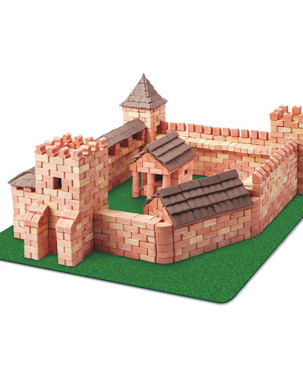 Model of a castle made from interlocking bricks on a green base