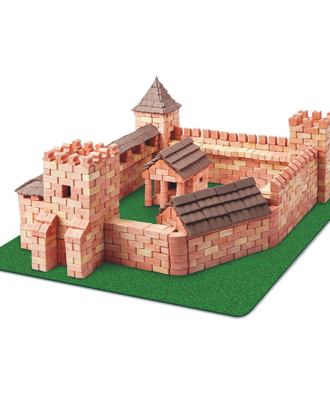 Model of a castle made from interlocking bricks on a green base