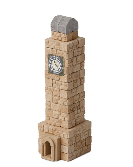 Toy clock tower with a clock face on a white background