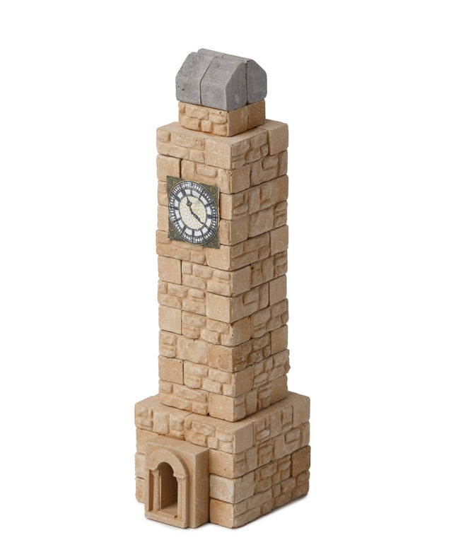 Toy clock tower with a clock face on a white background