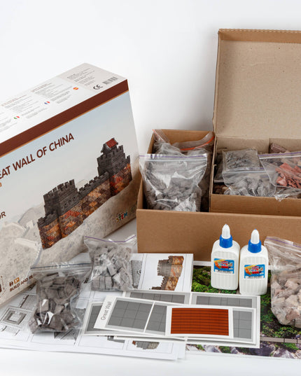 Model building kit for the Great Wall of China with packaging and components on a white background