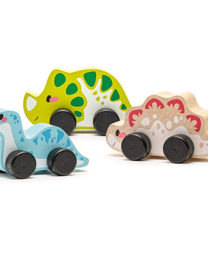 Set of three wooden dinosaur toys on a white background