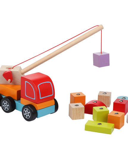 Colorful wooden toy truck with a crane lifting blocks on a white background