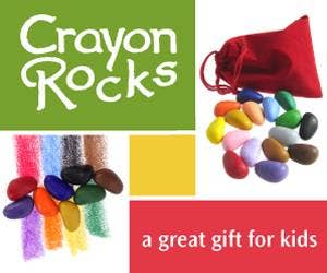 Crayon Rocks packaging with colorful crayons and a red bag on a green and red background.