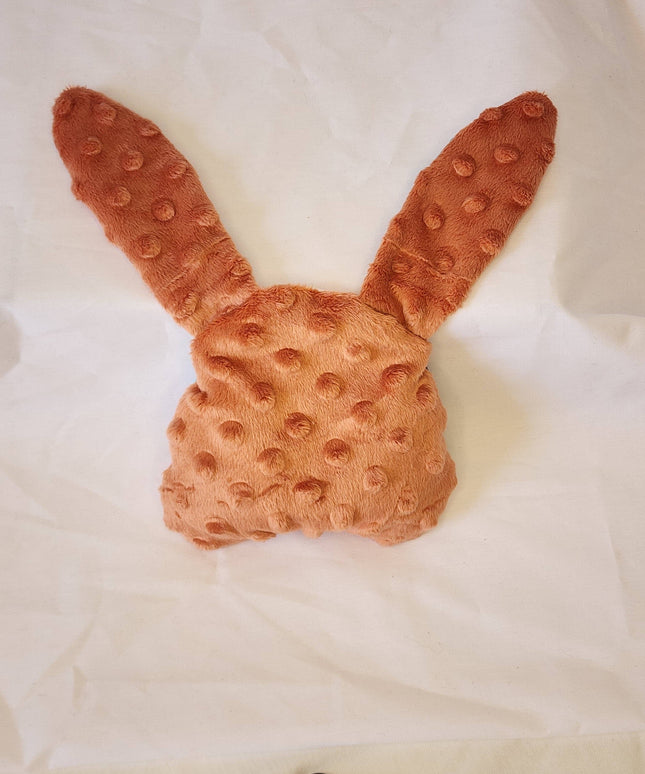 Textured brown bunny headband on a white background
