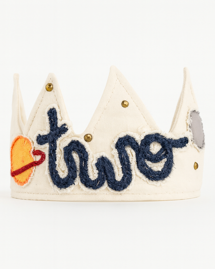 Children's crown with 'two' written on it against a white background