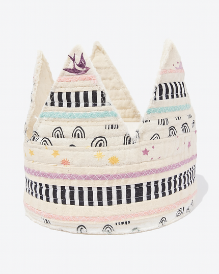 Decorative woven crown with colorful patterns on a white background