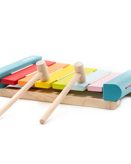 Colorful wooden xylophone with two mallets on a white background