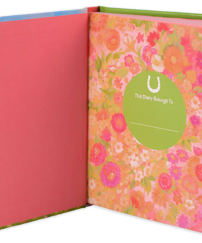 Floral notebook with a pink cover and green binding, featuring a visible brand logo.