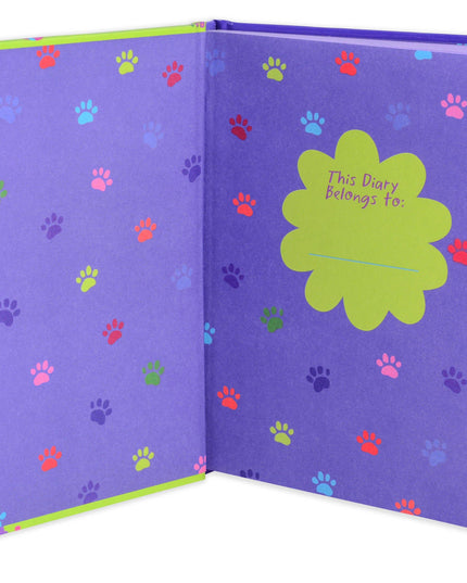 Purple diary with colorful paw prints and a green label on a white background