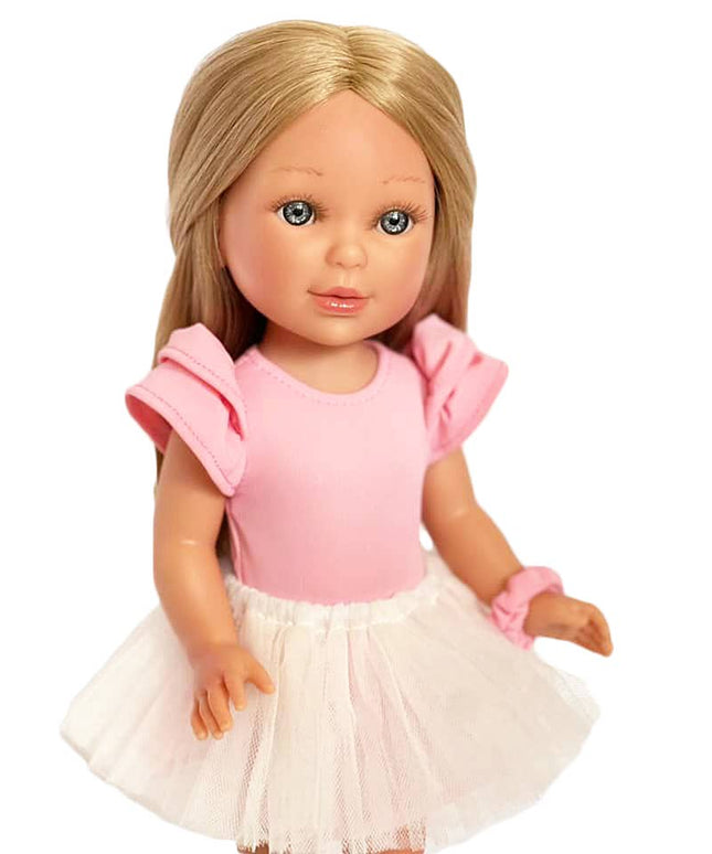Doll with blonde hair wearing a pink top and white skirt on a white background