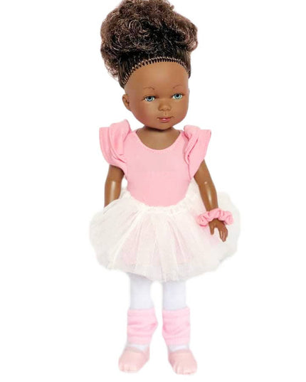 Doll in a pink outfit with a white background