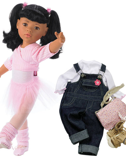Doll with pink outfit and accessories, including overalls and shoes, on a white background.