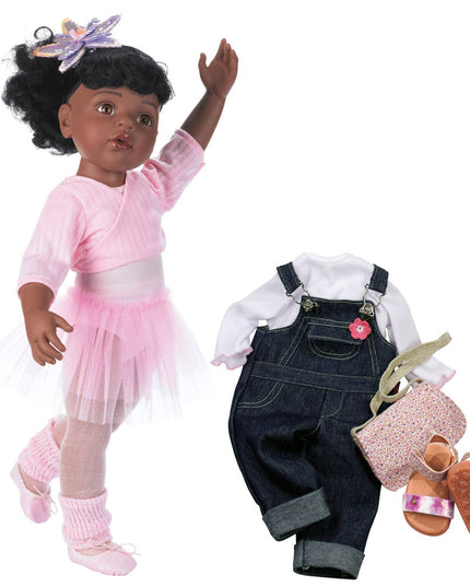 Doll with pink outfit and accessories on a white background