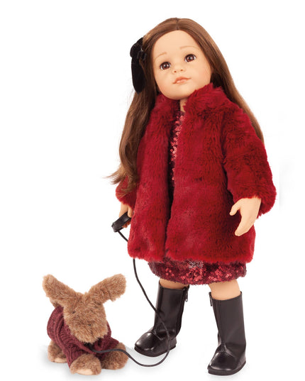 Doll wearing a red fur coat with a small dog on a white background