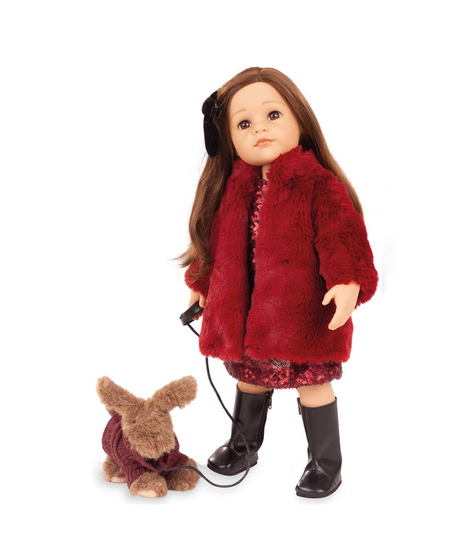 Doll wearing a red fur coat with a small dog on a white background