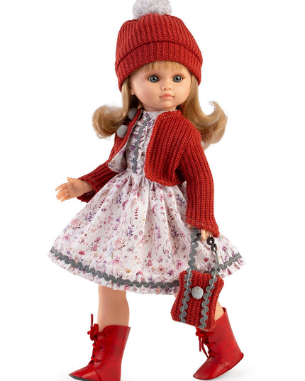 Doll wearing a red outfit with a floral dress on a white background