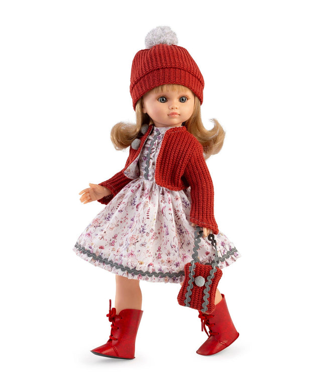 Doll wearing a red outfit with a floral dress on a white background