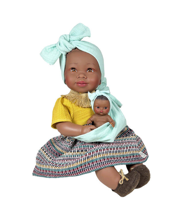 Doll holding a smaller doll with a colorful dress and headband on a white background