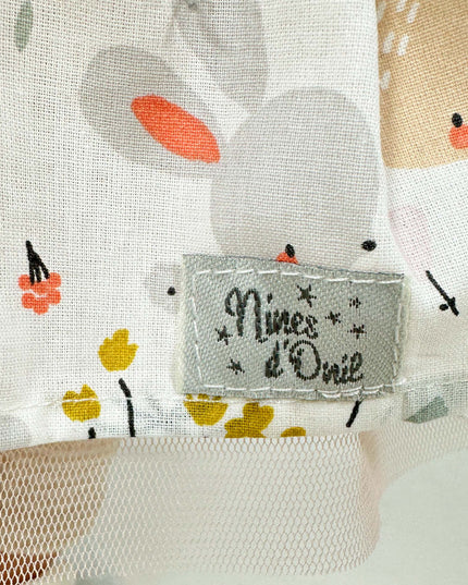 Fabric with cartoon mouse design and 'Nines d'Orle' label