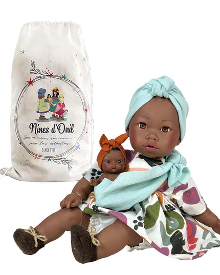 Dolls with a branded drawstring bag on a white background